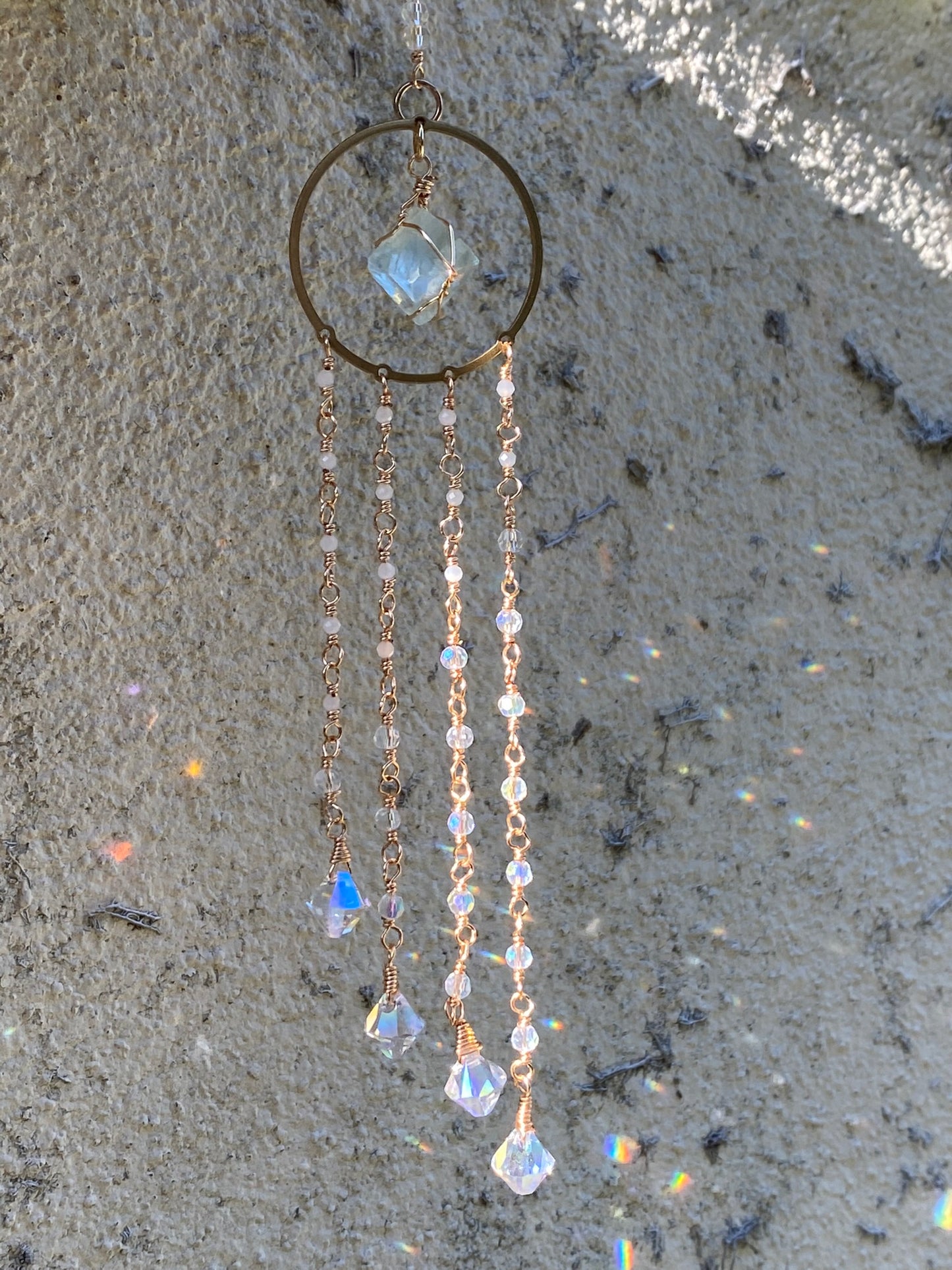 Fluorite Suncatcher with hand wrapped moonstone and crystal pendants