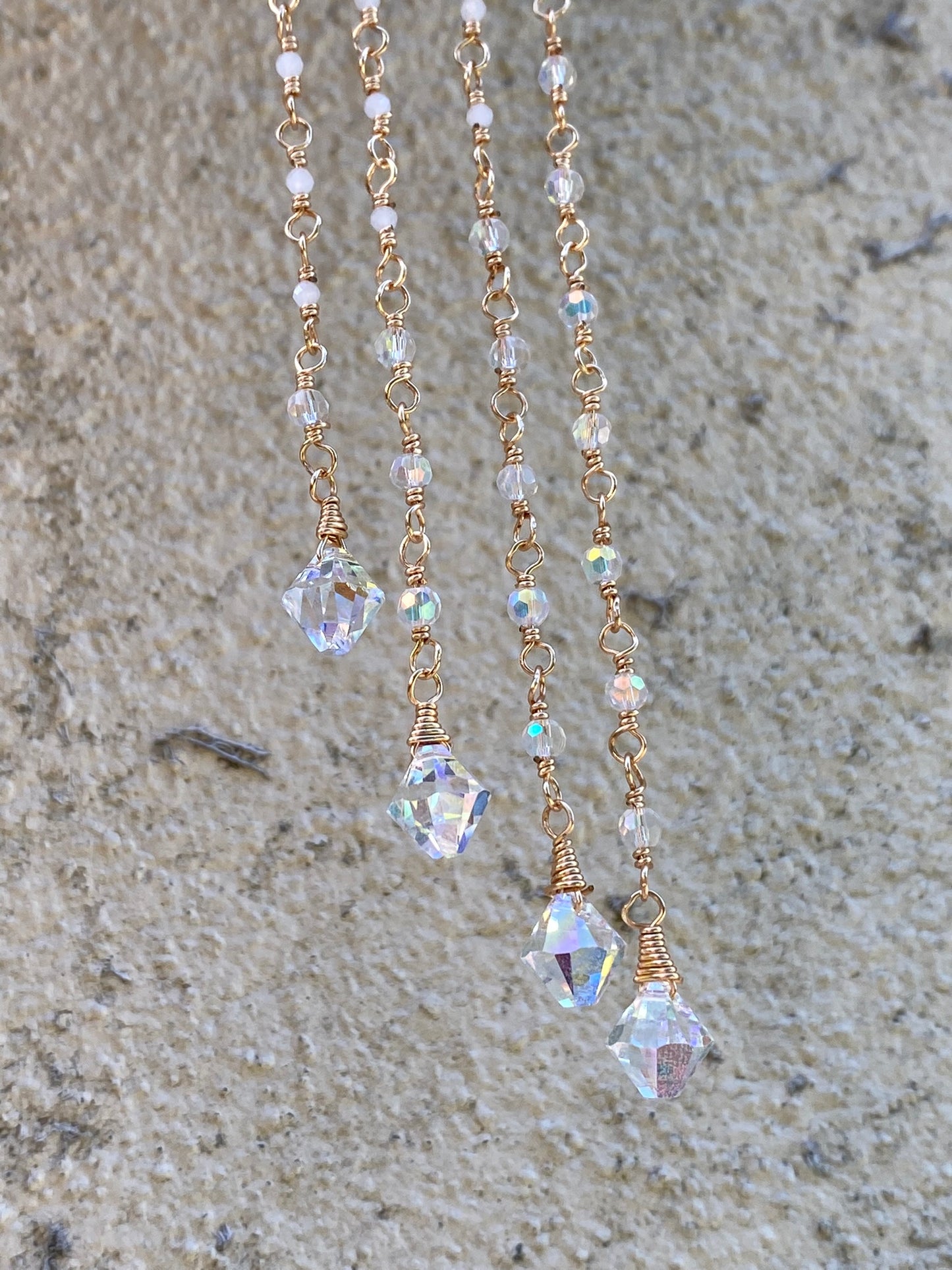 Fluorite Suncatcher with hand wrapped moonstone and crystal pendants