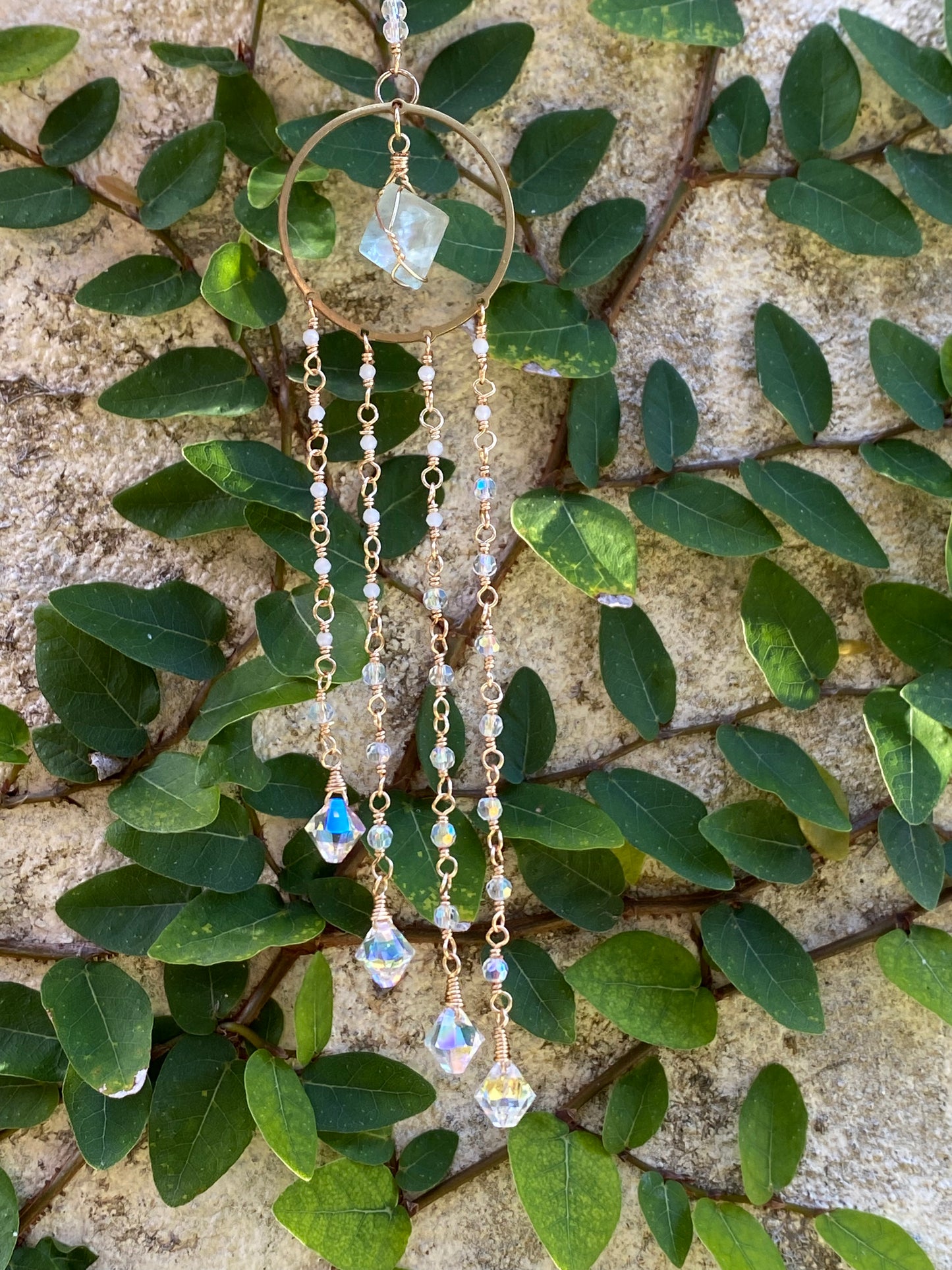 Fluorite Suncatcher with hand wrapped moonstone and crystal pendants